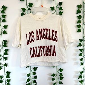 Cute tee from brandy Melville, it is one size, but I assume it is like a medium.